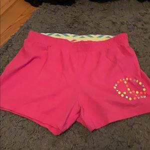 Pink shorts with a peace sign from faded glory
